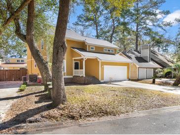 Charming two-story home with attached two car garage and mature landscaping in a quiet neighborhood at 104 Broadmarsh Ct, North Charleston, SC 29418
