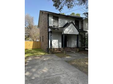 Two-story home featuring a blend of brick and siding with a welcoming front porch at 1770 Skinner Ave, Charleston, SC 29407