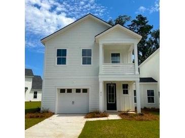 Charming two-story home with a welcoming front porch and attached garage, complemented by a well-maintained lawn at 424 Queenview Ln, Charleston, SC 29414