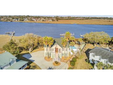 Stunning waterfront home with a charming exterior, gorgeous river views, and a private pool at 2399 Furman Dr, Charleston, SC 29414