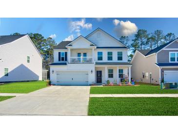 Charming two-story home with a well-manicured lawn and inviting curb appeal at 573 Yellow Leaf Ln, Summerville, SC 29486