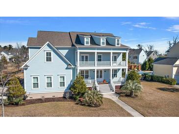 Charming two-story home with a welcoming double porch and a manicured lawn at 3003 Yachtsman Dr, Mount Pleasant, SC 29466