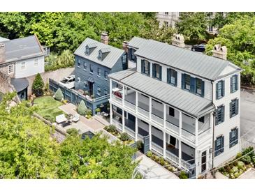 Stunning aerial view of a Charleston-style home with a manicured backyard and charming two-story design at 5 Alexander St, Charleston, SC 29401