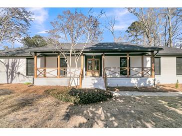 Charming single-story home featuring a welcoming front porch and classic design elements at 905 Battery Way, Mount Pleasant, SC 29464