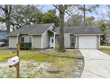 Charming single-story home with a well-maintained lawn, mature tree, and a mailbox out front at 105 Gatewood St, North Charleston, SC 29418