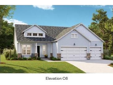 Charming single-story home featuring light blue siding, stone accents, and a convenient two-car garage at 1146 Darling St, Summerville, SC 29485