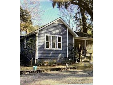 Charming home with gray siding, white trim, large windows, and a screened-in porch at 236 Ellen Reid Ln, Summerville, SC 29485