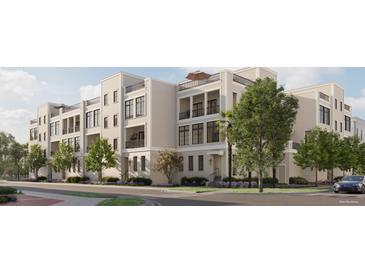 A charming multi-story townhome features balconies and black window frames, blending modern design with comfortable living at 317 Longshore St # 317, Charleston, SC 29492