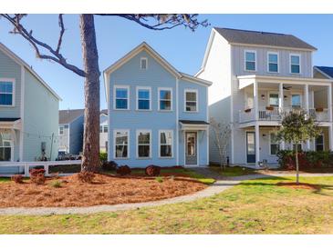 Charming blue two-story home with well-kept landscaping and inviting curb appeal at 4416 Louisa Ln, North Charleston, SC 29405