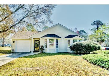 Charming single-story home featuring a well-maintained front yard and an attached garage, creating a welcoming curb appeal at 501 Hedge Way, Summerville, SC 29486