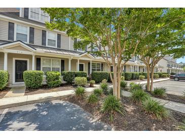 Charming townhomes with well-manicured landscaping, sidewalks, and plenty of parking spaces at 711 Hemingway Cir, Summerville, SC 29483