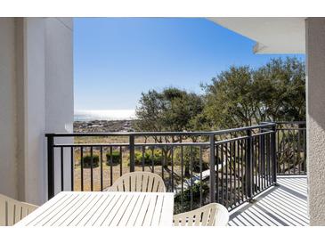 Balcony with outdoor dining set and views of the beach, dunes, and Gulf of Mexico at 7600 Palmetto Drive # D-222, Isle of Palms, SC 29451