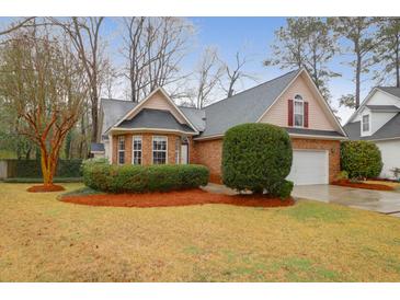 Charming brick home featuring manicured landscaping and an attached two-car garage at 109 Nelson Ct, Summerville, SC 29485