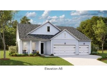 Charming single-Gathering home with a two-car garage, a welcoming front porch, and manicured landscaping at 1156 Darling St, Summerville, SC 29485