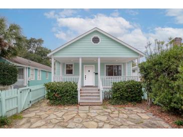 Charming mint green cottage with a cozy front porch and flagstone walkway at 19 N Enston Ave, Charleston, SC 29403