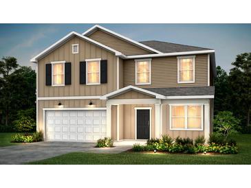 Charming two-story home featuring a covered porch, a two-car garage, and manicured landscaping at 215 W Bradford Pointe Drive Dr, Summerville, SC 29483