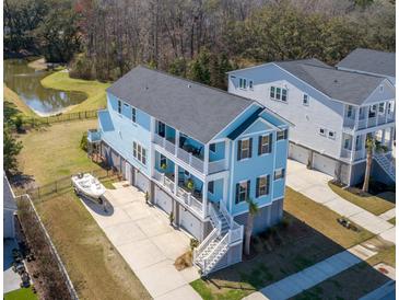 Stunning aerial view of a coastal home with multi-level decks and boat parking at 2305 Sturgeon, Johns Island, SC 29455