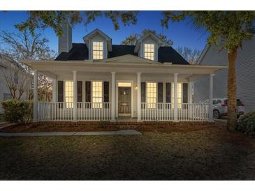 Charming two-story home with a welcoming front porch, white pillars and classic black shutters at 2461 Fulford Ct, Mount Pleasant, SC 29466