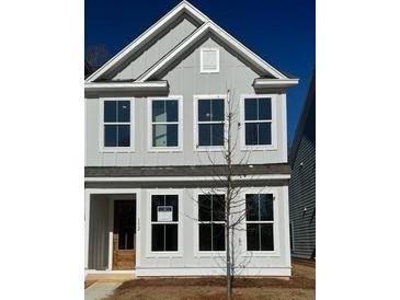 Charming two-story home with gray siding, white trim, and a welcoming front door at 147 Cantona Dr, Summerville, SC 29483