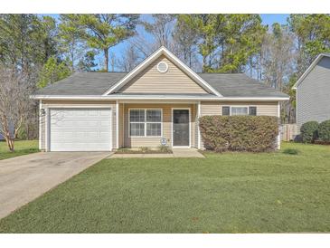 Charming single-story home with a well-manicured lawn and attached one car garage at 191 Blackstone Dr, Moncks Corner, SC 29461