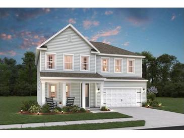 Charming two-story home featuring a symmetrical facade, a gabled roof, and an attached two-car garage at 2030 Mcguire Ln # 008, Hollywood, SC 29449