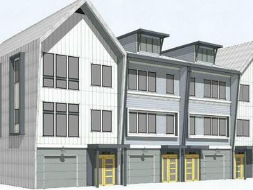 Charming exterior view of new townhouses with modern architectural details and attached garages at 1818 Orangeburg St, North Charleston, SC 29405