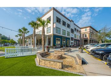 Charming multi-story building with a welcoming outdoor patio and firepit, perfect for community gatherings at 2007 E Patterson Pt, Hanahan, SC 29410