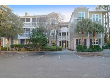 Well maintained condo building with manicured landscaping and assigned parking at 2212 Telfair Way, Charleston, SC 29412