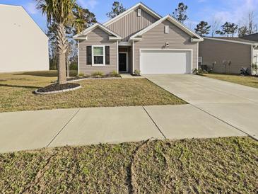 Charming single-Gathering home with tidy landscaping, a two-car garage, and a welcoming curb appeal at 307 Sedona Dr, Summerville, SC 29486