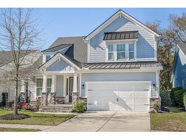 Beautiful two-story home featuring a welcoming front porch and a two-car garage at 1261 Gannett Rd, Mount Pleasant, SC 29464