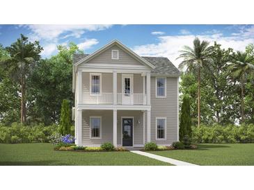 Charming two-story home with a welcoming front porch and classic architectural details at 318 Archar St, Summerville, SC 29486