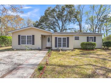 Charming single-story home featuring a well-maintained yard and traditional architecture at 834 Prince John Dr, Charleston, SC 29407