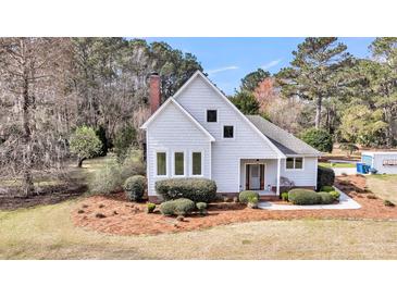 Charming two-story home with beautiful landscaping and inviting front entrance at 2224 Shoreline Dr, Johns Island, SC 29455