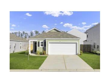 Charming single-story home with a two-car garage and a well-manicured front lawn at 446 White Scallop Way, Summerville, SC 29486