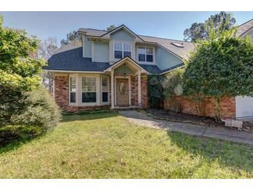 Charming two-story home with a well-maintained front yard and traditional architectural details at 2612 Morning Dove Ln, Charleston, SC 29414