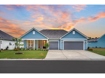Charming home featuring a two-car garage, well-manicured lawn, and inviting curb appeal at 733 Spring Highlands Dr, Summerville, SC 29486