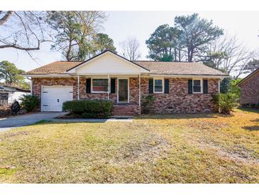 Charming brick home with manicured lawn and attached garage, creating instant curb appeal at 117 Loblolly Ln, Summerville, SC 29483