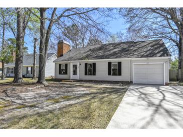 Charming single-story home featuring a garage and a well-maintained front yard and driveway at 201 Commons Way, Goose Creek, SC 29445