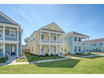 Charming two-story home with a welcoming front porch and beautifully landscaped front yard at 2739 Calico Bass Ln, Johns Island, SC 29455