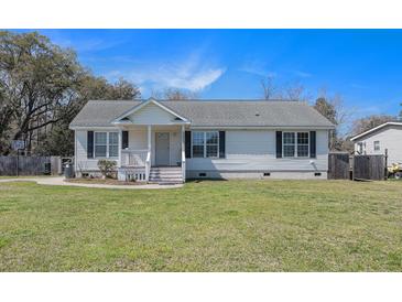 Charming single-story home with black shutters and a well-maintained front yard at 3075 Old Highway 52, Moncks Corner, SC 29461