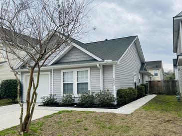 Charming single-Gathering home featuring well-maintained landscaping and a welcoming entrance at 4957 Trump St, North Charleston, SC 29420