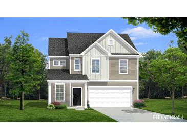 Charming two-story home with a well-manicured lawn, attached garage, and traditional architectural details at 476 Cadbury Loop, Summerville, SC 29486