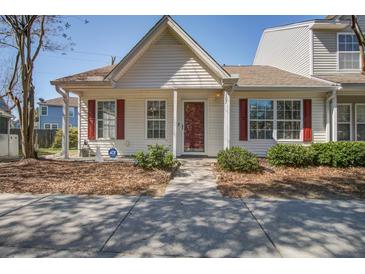 Charming home featuring red shutters, a well-manicured yard, and a welcoming front entrance at 507 Tayrn Dr, Charleston, SC 29492
