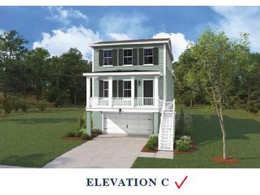 Charming two-story home with a welcoming front porch and a two-car garage at 712 Minton Rd, James Island, SC 29412
