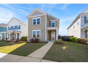 Charming two-story home with a well-manicured lawn and inviting walkway at 207 Billinger St, Summerville, SC 29486