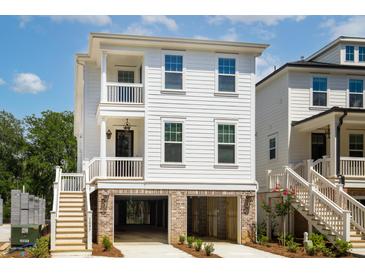 Charming two-story coastal home with a covered porch, brick foundation and ample parking at 3105 Vanessa Lynne, Johns Island, SC 29455