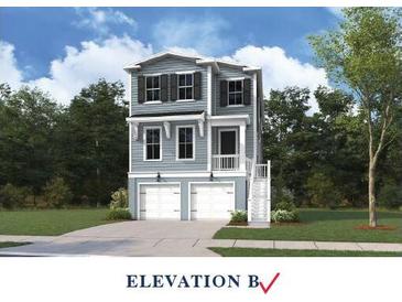 Charming two-story home with light blue siding, black shutters, and a two-car garage at 750 Minton Rd, Charleston, SC 29412