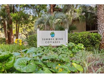 Summer Wind Cottages sign surrounded by lush, green landscaping at 1153 Summerwind Ln, Seabrook Island, SC 29455