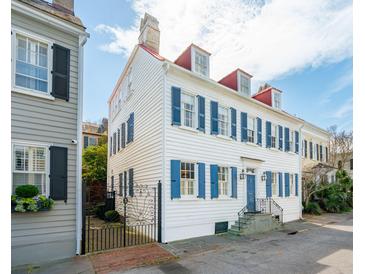 Charming two-story home featuring blue shutters and classic architectural details at 3 Atlantic St, Charleston, SC 29401