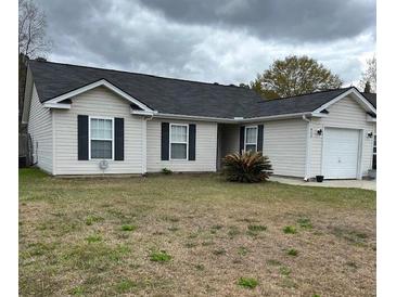 Charming single-story home with a well-maintained lawn and neutral siding at 429 Stephanie Dr, Goose Creek, SC 29445